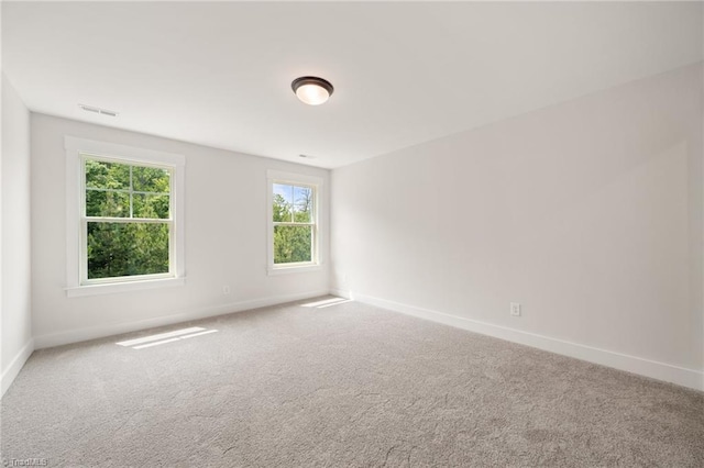 7815 Michaelis St, Greensboro, NC 27455 - spare room featuring baseboards and carpet flooring
