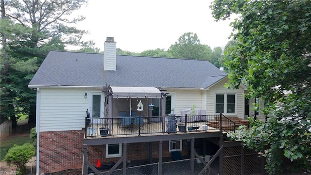 940 Huntington Run Ln, Kernersville, NC 27284 - back of house featuring a chimney, brick siding, and a wooden deck