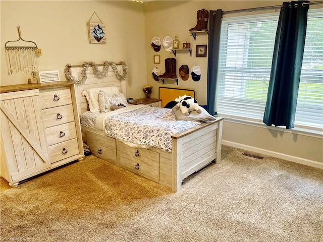 940 Huntington Run Ln, Kernersville, NC 27284 - bedroom with light colored carpet, multiple windows, and baseboards