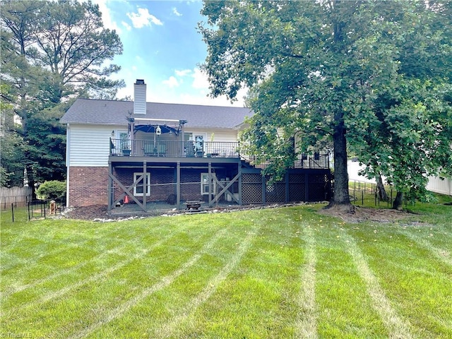 940 Huntington Run Ln, Kernersville, NC 27284 - rear view of house with a wooden deck, a chimney, and brick siding