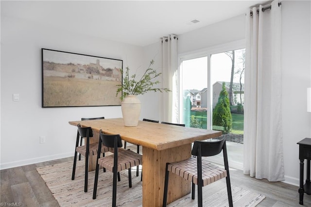 dining room with light hardwood / wood-style flooring