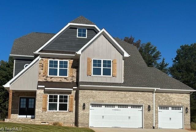 craftsman inspired home with a garage