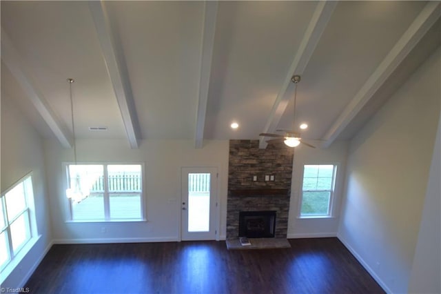 unfurnished living room featuring dark wood-type flooring, a fireplace, beam ceiling, and ceiling fan