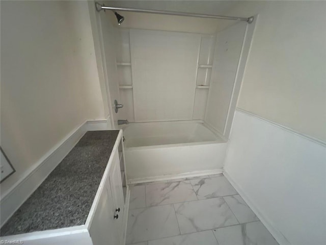 bathroom with vanity and bathtub / shower combination