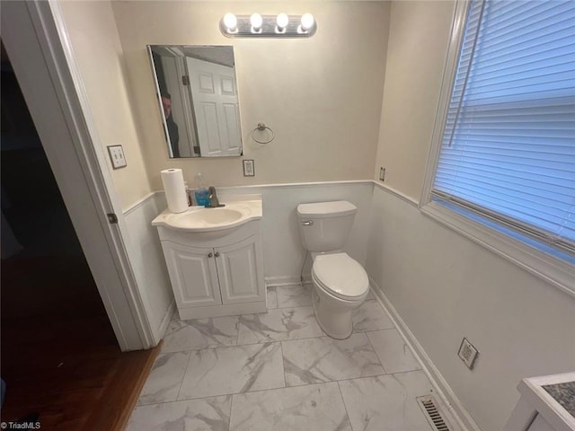 bathroom with vanity and toilet