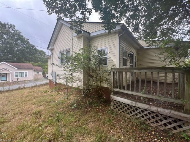 view of side of property featuring a deck