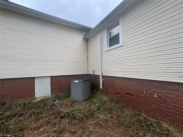 view of side of property with central AC