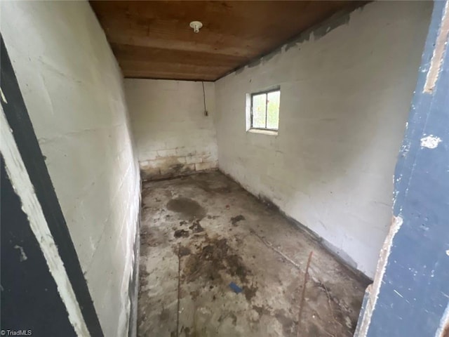 basement featuring wooden ceiling