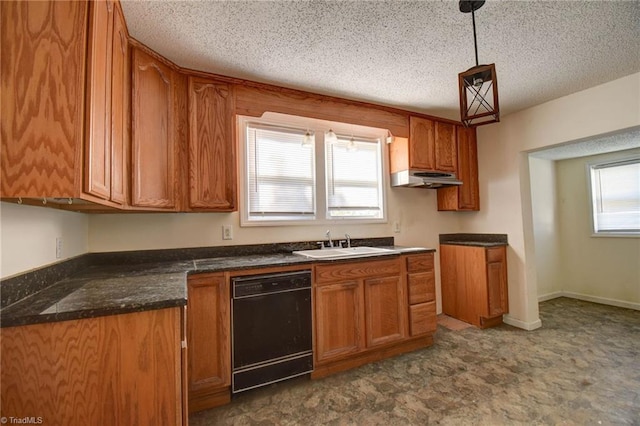 kitchen featuring black dishwasher, sink, decorative light fixtures, and plenty of natural light