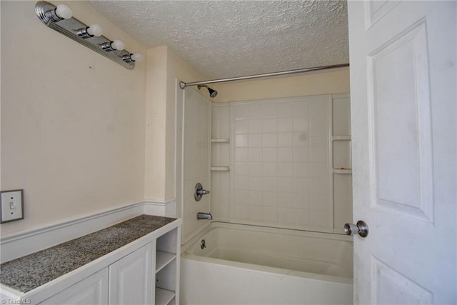 bathroom featuring shower / tub combination and a textured ceiling