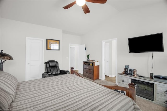 1009 Cannonade Dr, Whitsett, NC 27377 - carpeted bedroom featuring lofted ceiling, ceiling fan, and baseboards