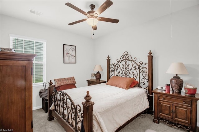 1009 Cannonade Dr, Whitsett, NC 27377 - bedroom featuring light carpet, a ceiling fan, and baseboards