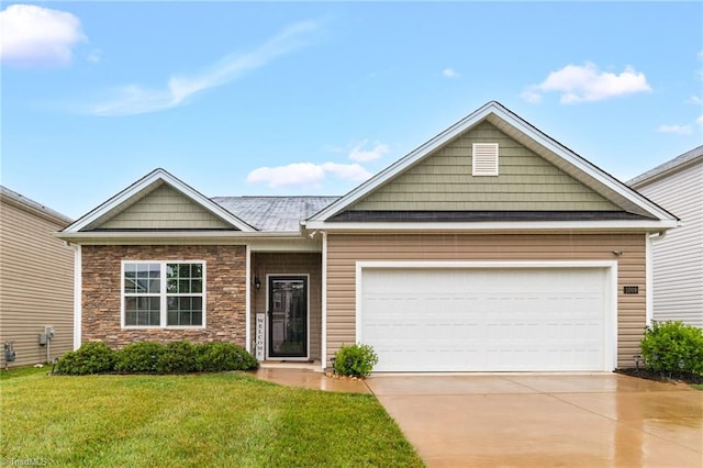 1009 Cannonade Dr, Whitsett, NC 27377 - view of front of property featuring driveway, stone siding, a front yard, and an attached garage
