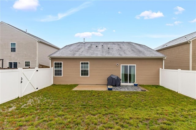 1009 Cannonade Dr, Whitsett, NC 27377 - rear view of house featuring a patio area and a gate