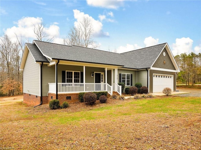 single story home with a garage, a front yard, and a porch