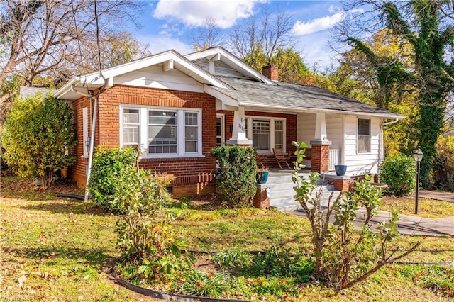 1112 Hamilton St, High Point, NC 27262 - bungalow-style home with brick siding, a chimney, and a porch