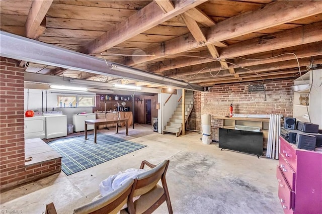 1112 Hamilton St, High Point, NC 27262 - below grade area with separate washer and dryer, stairway, and brick wall