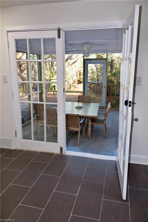 entryway featuring dark tile patterned flooring