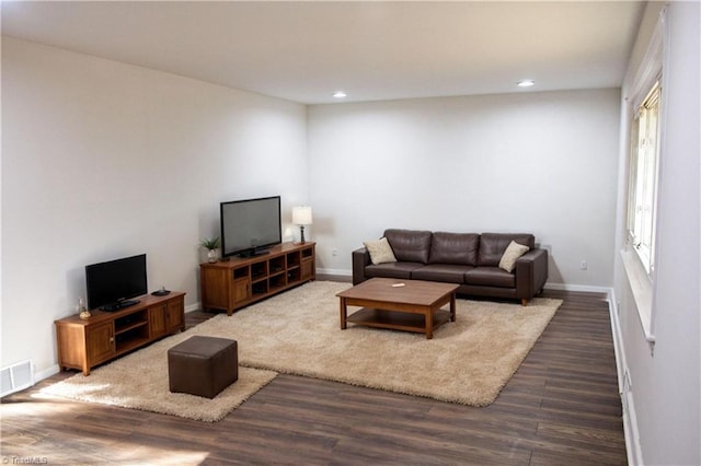 living room featuring dark hardwood / wood-style floors