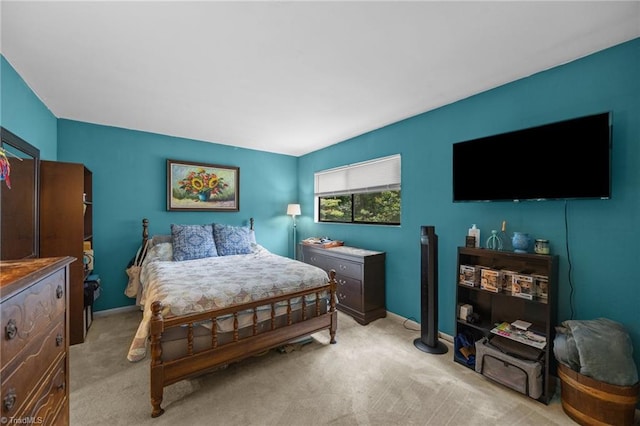 217 Village Ln Unit G, Greensboro, NC 27409 - bedroom featuring light carpet and baseboards