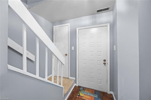 217 Village Ln Unit G, Greensboro, NC 27409 - entryway featuring stairs and baseboards
