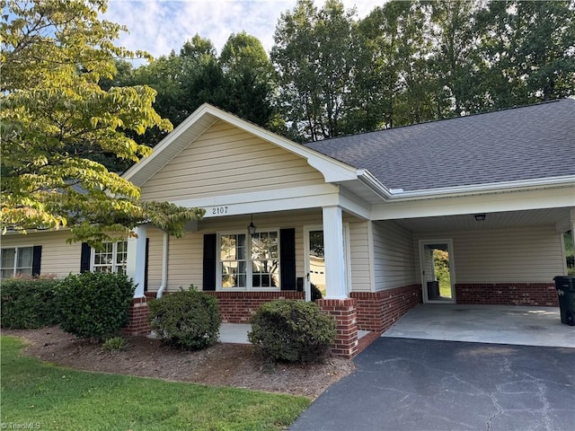 view of front of property with a carport