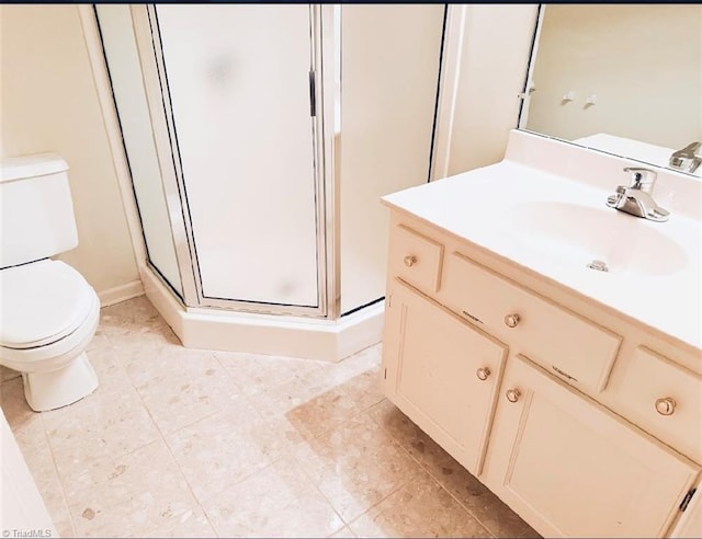 bathroom featuring tile patterned floors, walk in shower, vanity, and toilet