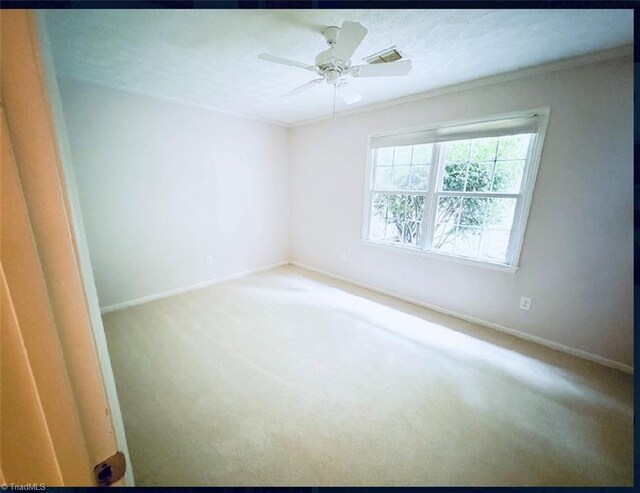 unfurnished room with ceiling fan