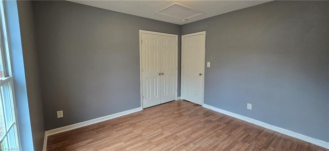 empty room with hardwood / wood-style flooring