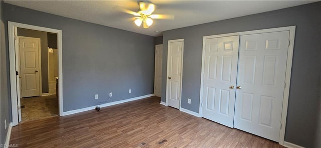 unfurnished bedroom with hardwood / wood-style floors and ceiling fan