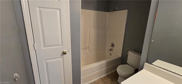 bathroom featuring shower / bathtub combination and toilet