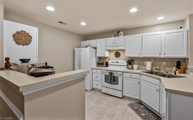 kitchen with recessed lighting, light countertops, visible vents, a sink, and white appliances