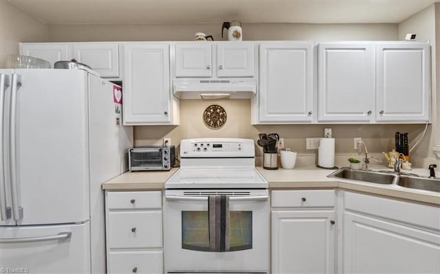 kitchen featuring white appliances, under cabinet range hood, white cabinetry, and light countertops