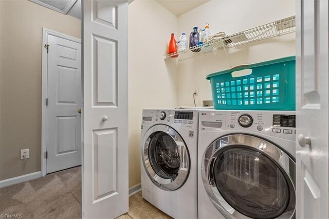 laundry room featuring laundry area, independent washer and dryer, carpet flooring, and baseboards