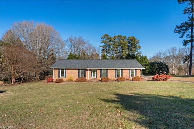 ranch-style home featuring a front yard