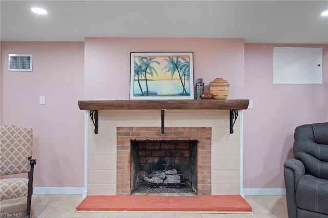 living room featuring a fireplace and light tile patterned floors