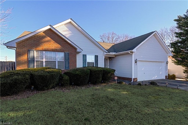 view of front facade featuring a front yard and a garage