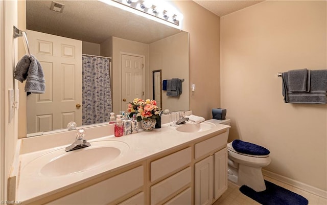 bathroom featuring curtained shower, toilet, and vanity