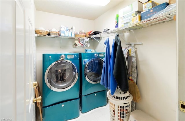 washroom featuring washing machine and dryer