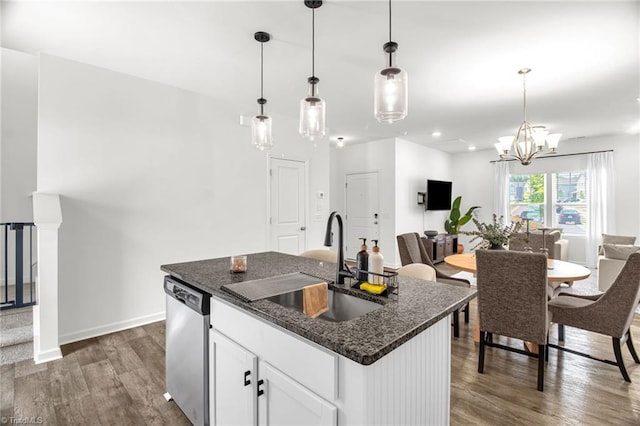 4062 Monteray Cir, High Point, NC 27265 - kitchen featuring stainless steel dishwasher, a sink, wood finished floors, open floor plan, and white cabinetry