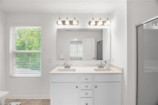 4062 Monteray Cir, High Point, NC 27265 - bathroom with double vanity, a shower with door, and baseboards