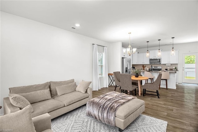 4062 Monteray Cir, High Point, NC 27265 - living room featuring a chandelier, recessed lighting, and dark wood-style floors