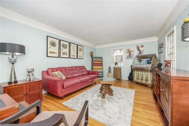 living room featuring ornamental molding and light wood finished floors
