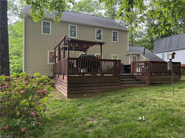 back of property with a yard and a deck