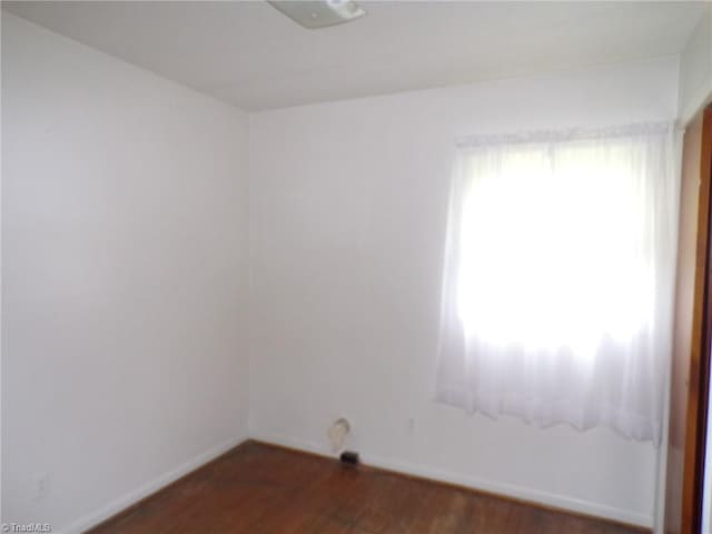 2600 Alamance Church Rd, Greensboro, NC 27406 - unfurnished room with wood finished floors and baseboards