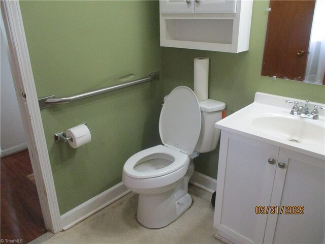 2600 Alamance Church Rd, Greensboro, NC 27406 - half bathroom featuring vanity and toilet