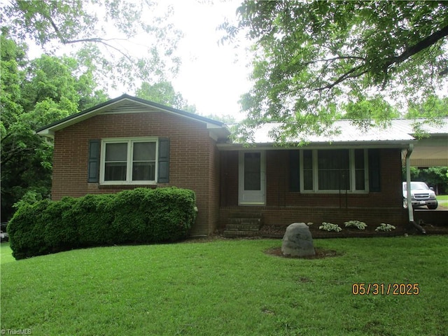 2600 Alamance Church Rd, Greensboro, NC 27406 - ranch-style home featuring brick siding, a front lawn, and a carport
