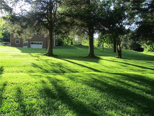 2600 Alamance Church Rd, Greensboro, NC 27406 - view of grassy yard with a garage