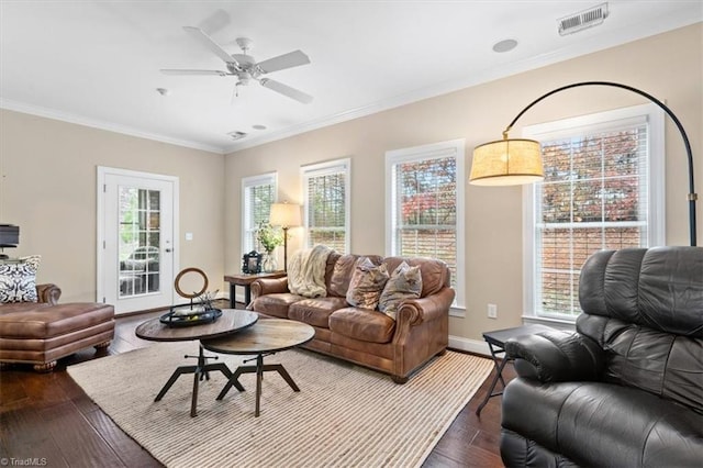 living room with hardwood / wood-style floors, ceiling fan, and crown molding