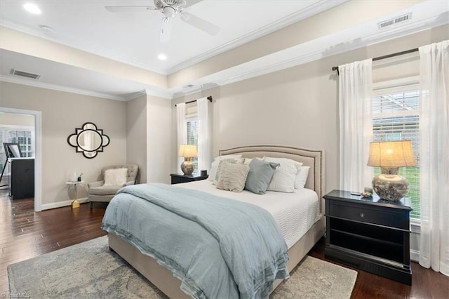 bedroom with ceiling fan, crown molding, and dark hardwood / wood-style floors